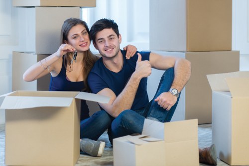 Professional movers assisting with packing and loading in a Kingston home