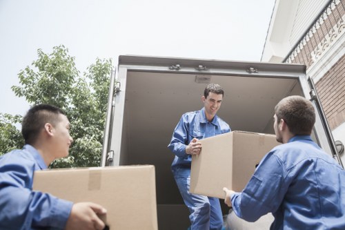 Professional movers loading furniture with care in Kingston
