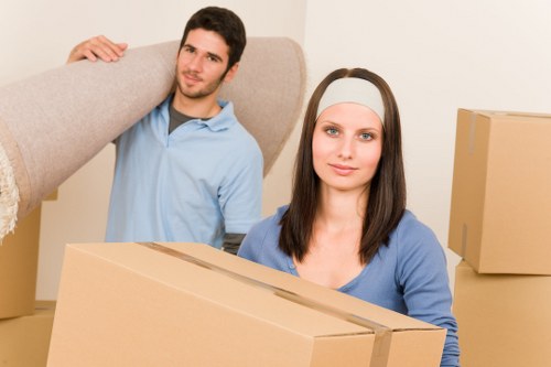 Removals team handling boxes and furniture in Kingston