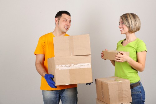 Loading boxes and household items into a van in Kingston